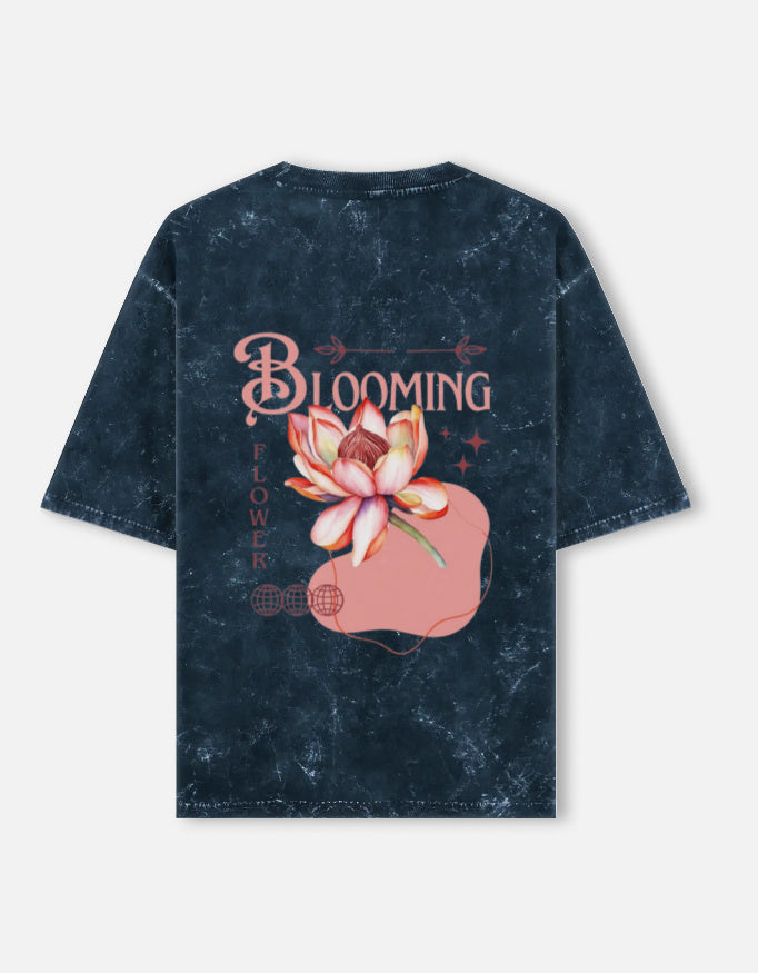 Back view of LYVIT ORIGINALS acid washed oversized tee with a relaxed fit and faded, textured fabric.