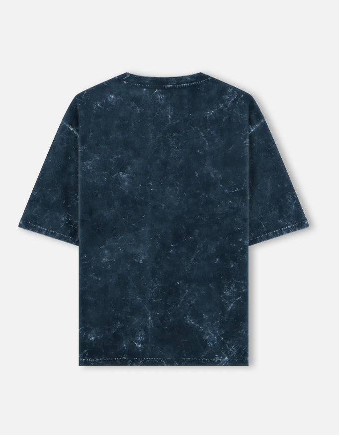 Back view of unisex acid washed oversized tee by LYVIT ORIGINALS, showcasing relaxed fit and faded fabric texture.