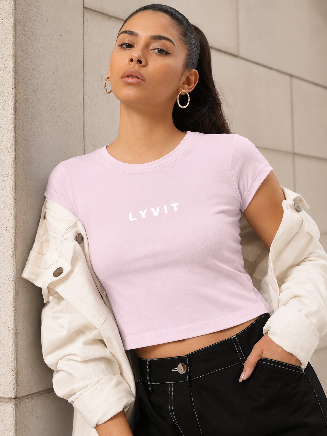 Pink baby tee by LYVIT Originals, featuring soft fabric and a comfortable fit for infants, with short sleeves and a round neckline.