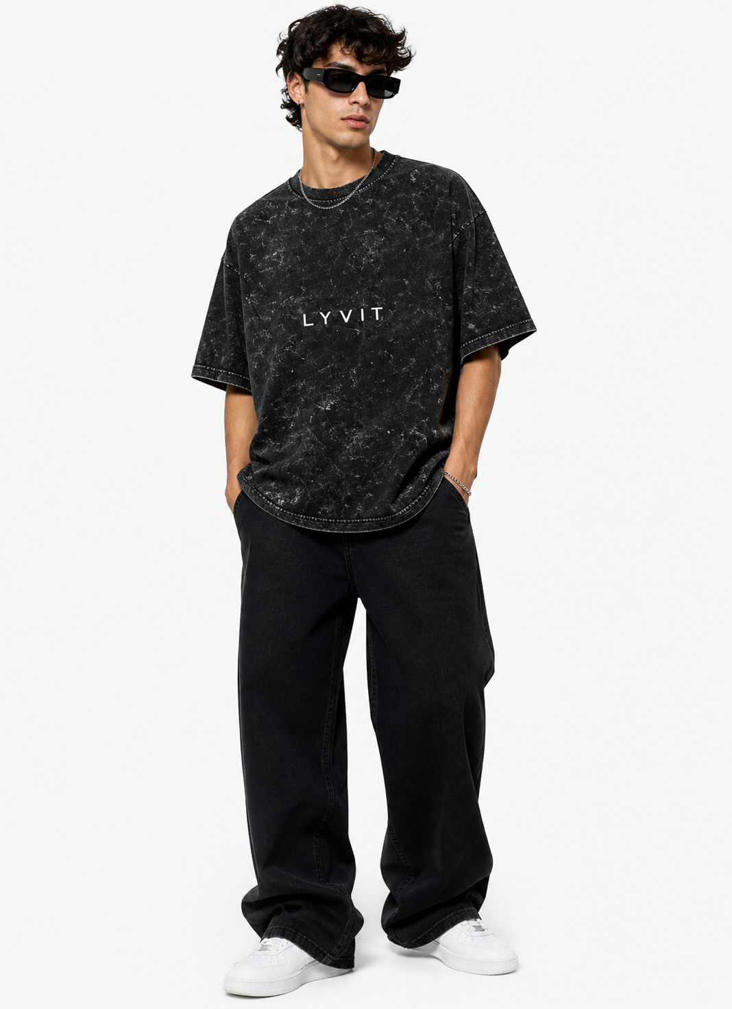 Unisex acid washed oversized T-shirt by LYVIT ORIGINALS, showing relaxed fit and vintage-inspired design in the image.