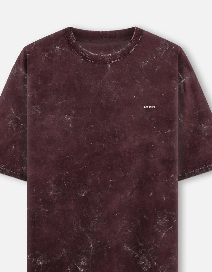 Acid washed oversized LYVIT ORIGINALS T-shirt with a left chest pocket, relaxed fit, and distressed fabric details.