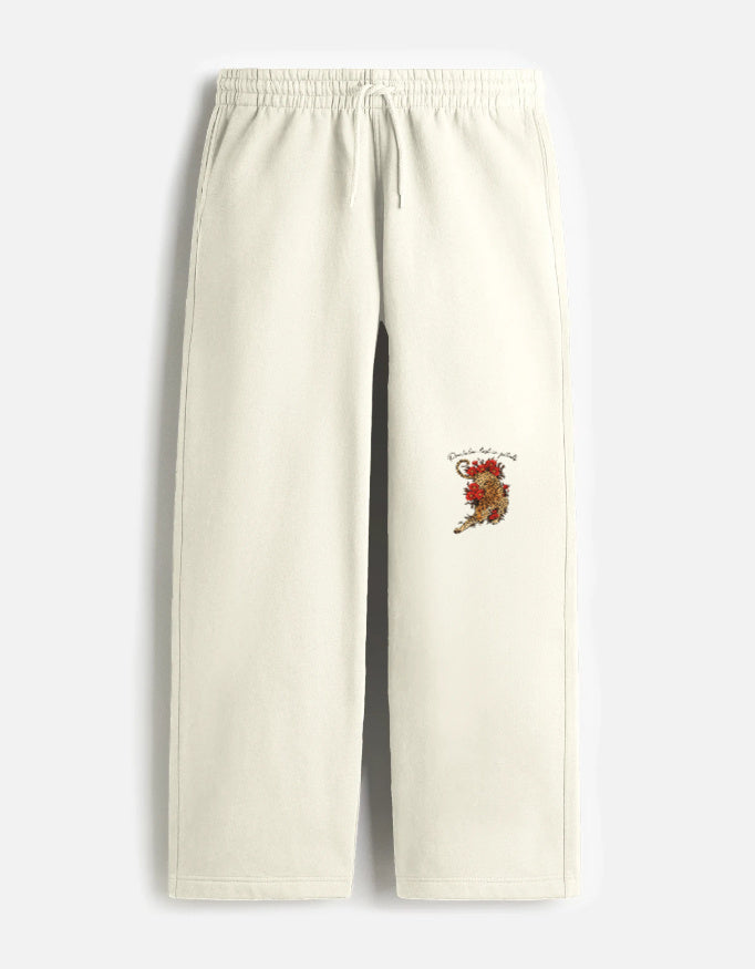 Unisex LYVIT ORIGINALS sweatpants displayed on a model, showing the relaxed fit and soft fabric from the left shoulder angle.